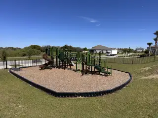 Community Amenities A vibrant community playground in Silverlake by Pulte Homes (Lake Alfred, FL), offering a safe and fun space for families to enjoy outdoor activities.