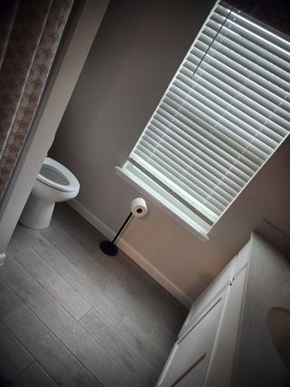 A stylish bathroom featuring neutral tones, sleek cabinetry, and natural light for a clean and refreshing feel.
