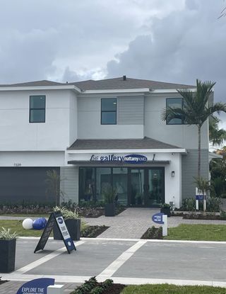 A stylish modern home with sleek lines and lush landscaping in the Forest – Townhomes by Mattamy Homes (Lake Worth, FL).