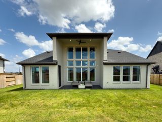 Street view A beautiful modern home with expansive windows and a manicured lawn in Grange 55' by Westin Homes (Katy, TX).