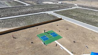 Community Amenities A vibrant sports court in the open landscapes of Dauer Ranch by Legend Homes, New Braunfels, TX.