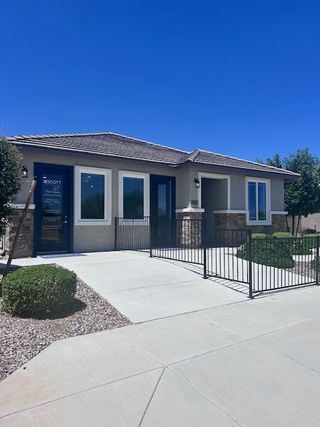 A modern single-story home with a fenced yard in The Views at Rancho Cabrillo by Scott Communities (Peoria, AZ).
