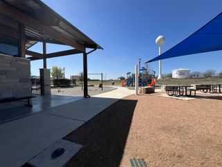 Community Amenities A vibrant community park with a shaded playground in Crosswinds by Milestone Community Builders (Kyle, TX).