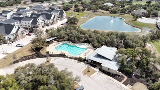 Community Amenities A resort-style pool, scenic pond, and clubhouse create the perfect retreat in Palmera Bluff by Coventry Homes (Leander, TX).