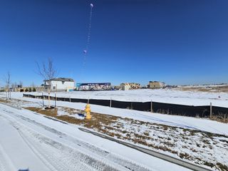 A snowy construction site with model homes in Legato by Century Communities (Commerce City, CO).