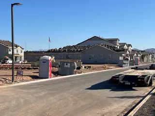 New homes under construction with modern design in Village at Pioneer Crossing by Blandford Homes (Mesa, AZ).