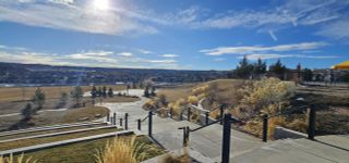 Sunny landscaped pathways with sprawling views in Rhyolite Ranch by Kauffman Homes, Castle Rock, CO.