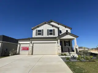 A charming modern home with a manicured yard in Seasons at Calumet II by Richmond American Homes (Jarrell, TX).