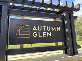The Autumn Glen community entrance features a modern sign and landscaping by D.R. Horton in Belleview, FL.