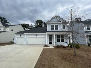 A beautiful two-story home with a three-car garage in the Enclave at South Pointe Estates by DRB Homes (Summerville, SC).