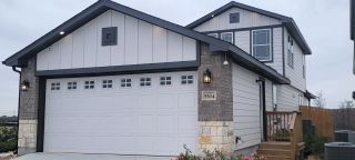 A charming modern home with a stylish exterior in Red Hawk Landing by First America Homes (San Antonio, TX).