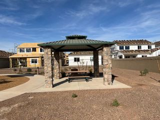 Charming gazebo and new homes under construction in El Cidro by Pulte Homes, Goodyear, AZ, offering community living.