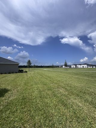 Expansive green lawns and spacious lots in Holstein Crossing: Holstein Crossing 50s by Lennar (Green Cove Springs, FL).
