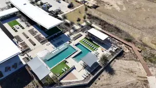 Community Amenities An aerial view of a modern recreation area with a pool and seating in Easton Park 50s by Taylor Morrison (Austin, TX).