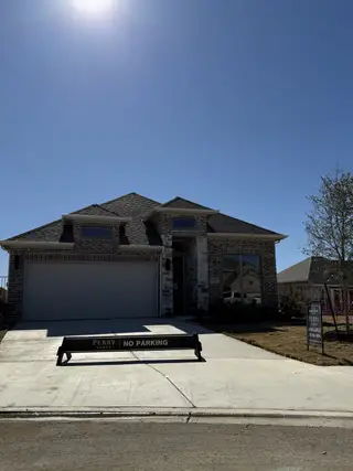Beautiful brick home with modern design in Santa Rita Ranch by Perry Homes, Liberty Hill, TX.