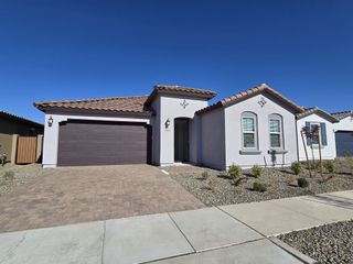 Beautiful single-story home with a tile roof and desert landscaping in Blossom Rock: Horizon by Lennar (Apache Junction, AZ).
