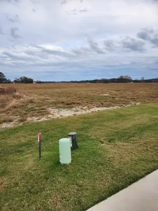 Expansive open land with vast skies in Williams Run by Ryan Homes (Bailey, NC). A serene canvas for future development.