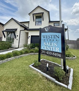 Charming white brick home with modern accents in Sienna - 45' by Westin Homes, located in Missouri City, TX.
