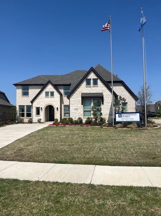 A beautiful stone-brick home with neat landscaping in Ridge Ranch Classic 60 by Bloomfield Homes, Mesquite, TX.