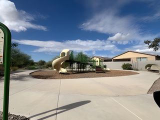 A family-friendly playground with slides in Arroyo Grande by Scott Communities (Casa Grande, AZ).