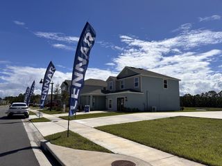 A modern two-story home with a spacious driveway in Preserve at LPGA by Lennar (Daytona Beach, FL).