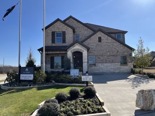 Beautiful brick home with manicured landscaping in Forest Park by M/I Homes (Princeton, TX).