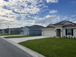 Charming modern homes on a sunny street in Oak Hill Plantation by Adams Homes, Ocala, FL.