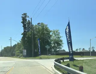 New homes surrounded by lush greenery in Hills of Westlake by D.R. Horton, Conroe, TX.