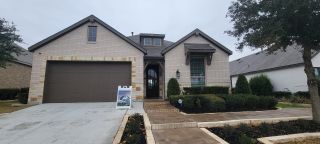 Street view Beautiful light brick home with manicured landscaping in Davis Ranch: 60ft. lots by Highland Homes (San Antonio, TX).