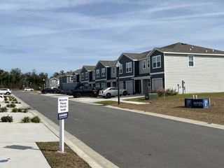 Modern townhomes with sleek gray siding in The Towns at Laurel Commons by D.R. Horton, Ocala, FL.