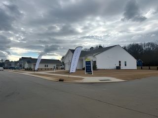 A modern neighborhood under a cloudy sky in Bryson's Ridge by Starlight Homes (Spring Hope, NC).