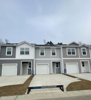 Elegant townhomes with modern siding in serene Dawson Branch by Starlight Homes, Summerville, SC.