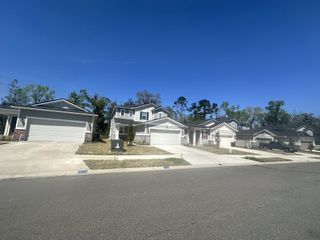 Modern homes with spacious driveways in Seasons at Marietta Cove by Richmond American Homes (Jacksonville, FL).