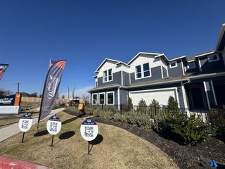Street view Charming modern homes with landscaped yards in Center 45 by Pacesetter Homes, located in Round Rock, TX.