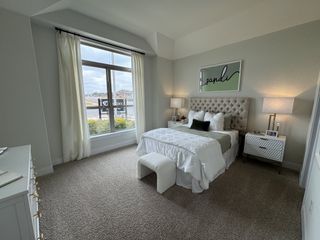A serene bedroom retreat with a tufted headboard, plush bedding, and natural light in Veramendi by Coventry Homes (New Braunfels, TX).