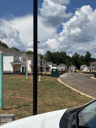 Charming new construction homes lining a quiet street in Millers Pointe by Lennar, nestled in Conyers, GA.