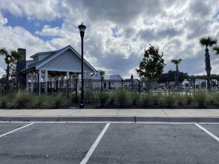 Community Amenities A charming community space with a pavilion and landscaped grounds in Watson Hill by Ashton Woods (Summerville, SC).