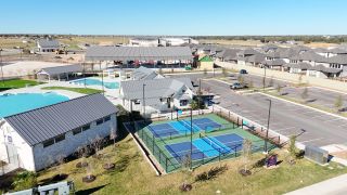 Community Amenities Modern community amenities featuring pools and sports courts at Santa Rita Ranch by Westin Homes (Liberty Hill, TX).