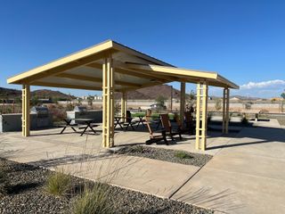 A modern outdoor pavilion with grills and picnic tables in Miravida by Mattamy Homes (Surprise, AZ).