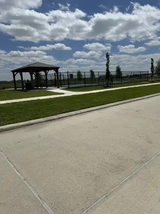 Street view A serene park with a gazebo and sports court at Winfrey Estates by ROC Homes in Tomball, TX.