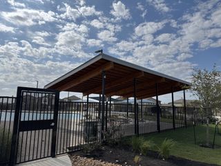 Community Amenities A modern covered community pool area in Firefly Pointe: Watermill Collection by Lennar, Hutto, TX.