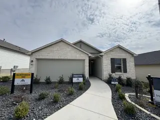 A charming stone facade home with landscaped entry in Hunters Ranch by M/I Homes, San Antonio, TX.