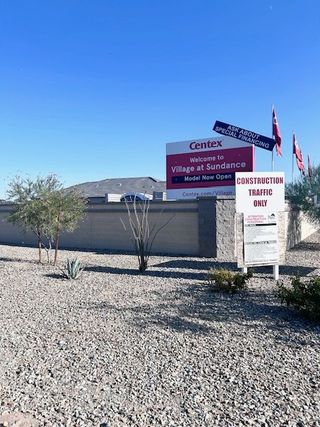 A welcoming entrance to Village at Sundance by Centex, highlighting new models in Buckeye, AZ, with clear desert landscaping.