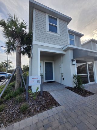 A modern two-story home with a sleek design in Horse Creek at Crosswinds by Taylor Morrison (Davenport, FL).