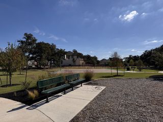 A scenic park with basketball court and benches in Highland Village by Coventry Homes (Georgetown, TX).