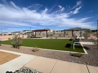 A landscaped park area with seating and pathways in The Ridge Collection at North Copper Canyon by Century Communities (Surprise, AZ).