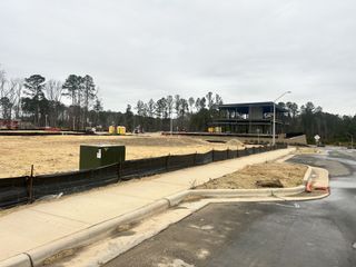 A developing neighborhood with roads and sidewalks taking shape in Twyla Walk by Stanley Martin Homes (Cary, NC).