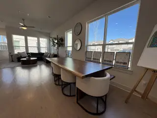 Model Home A spacious open-concept living area with abundant natural light, sleek wood flooring, and stylish décor.