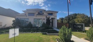 Elegant brick home with lush landscaping in Veranda 40' by Perry Homes, San Antonio, TX.