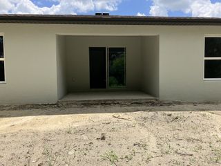 A modern neutral-toned home exterior in Spring Hill Classic by Century Complete (Spring Hill, FL).